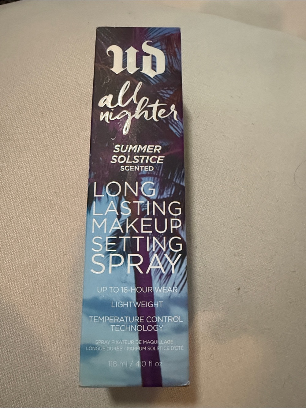 Urban Decay All Nighter Setting Spray Packaging in Gradient Purple and Blue
